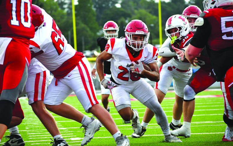 Enoch Autry/The Clayton Tribune. Rabun County sophomore running back Amir Thompson goes up the middle in the second half of the scrimmage against Franklin for a touchdown. The score was set up by multiple runs by senior running back JK Fruster. The Wildcats open their regular season on Aug. 28 at home against Metter.