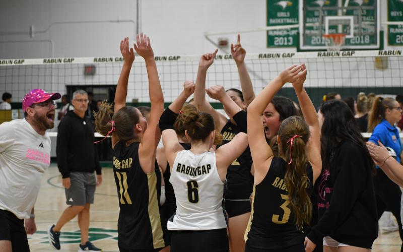 Wesley Branch/The Clayton Tribune. The Rabun Gap girls volleyball team celebrates its first-round playoff win versus Cannon School on Oct. 14, 2025.