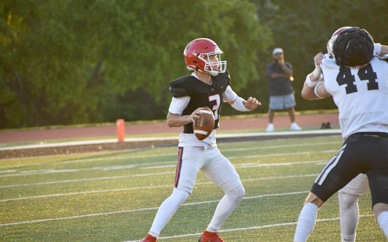 Wesley Branch/The Clayton Tribune. Rabun County’s Cooper Kowalsky looks downfield for an open receiver during the Wildcats’ spring game versus White County on May 15. Kowalsky is entering his first season as RCHS’s starting QB.
