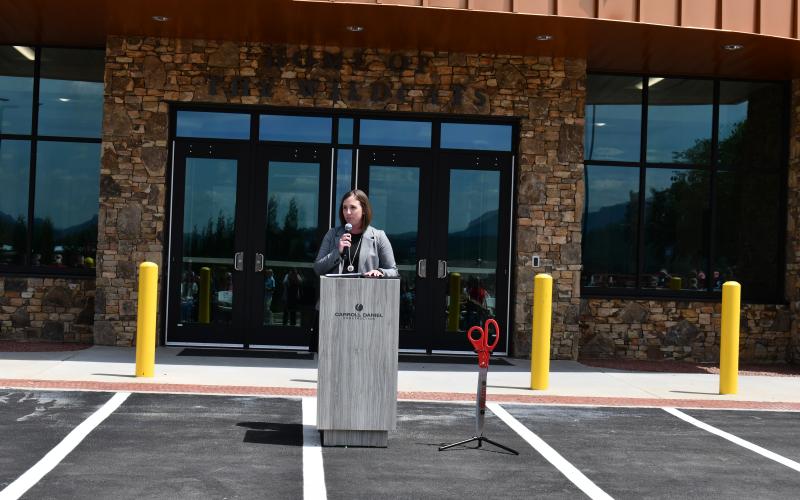 Megan Horn/The Clayton Tribune. Rabun County High School Principal Kelsey Thompson gives opening remarks at the July 31 ribbon cutting celebration for the new Rabun County High School Academic Building.