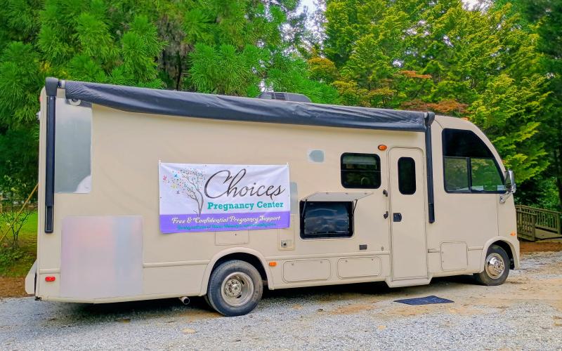 Megan Horn/The Clayton Tribune. Choices Pregnancy Center’s new 25 ft. Medical Mobile Unit was on display during the Heartbeat Gala on Aug. 1. Gala attendees got the opportunity to tour the unit and see how it expands services to neighboring counties.