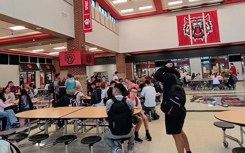 Megan Horn/The Clayton Tribune.  Rabun County middle and high school students mingle in the cafeteria on the first day of school Monday, Aug. 3.