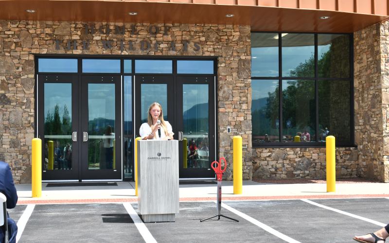 Megan Horn/The Clayton Tribune. Class of 2027 senior Bailey Weber speaks during the ribbon cutting ceremony to give the student perspective on the new academic building. She said she and her classmates are looking forward to the learning opportunities that will be available in the new building.