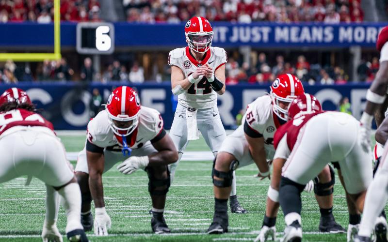 Keith Barlow/CNI News Service.  Stockton prepares to take the snap against Alabama in the SEC championship.