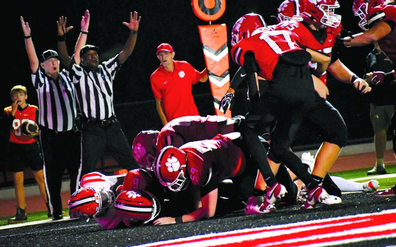 Enoch Autry/The Clayton Tribune.  Two game officials signal a rushing touchdown for JK Fruster  in the Wildcats’ 27-23 home win over Metter. Fruster scored three touchdowns and rolled up 137 yards on the ground in the contest.