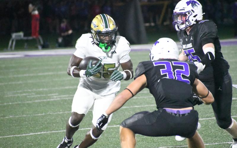 Wesley Branch/The Clayton Tribune. Rabun Gap running back Jordan Lindo looks for room to run during the Eagles’ Aug. 28 loss to Brownsburg. RGNS will look to get back on track in the running game Friday versus No. 6 ranked Baylor, after rushing for 61 yards last week.