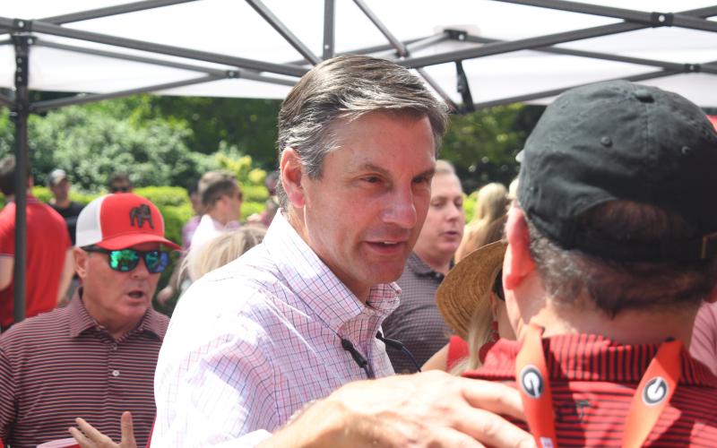 Wesley Branch/The Clayton Tribune. Derek Dooley talks to Dawg fans before the 2025 Marshall game as Dooley announces his intentions to run for U.S. Senate.