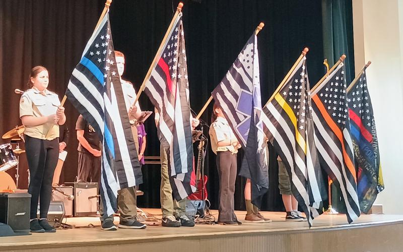 Megan Horn/The Clayton Tribune. Scouts of America, Troop presents flags to honor each branch of public safety during the fourth annual First Responders’ Appreciation Dinner Aug. 27.