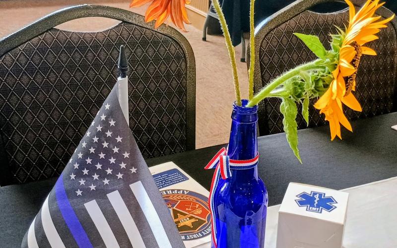 Megan Horn/The Clayton Tribune. Centerpieces at the fourth annual First Responders’ Appreciation Dinner held at the Rabun County Civic Center were public safety-themed with color added with beautiful sunflowers from Annette’s Flower Farm.