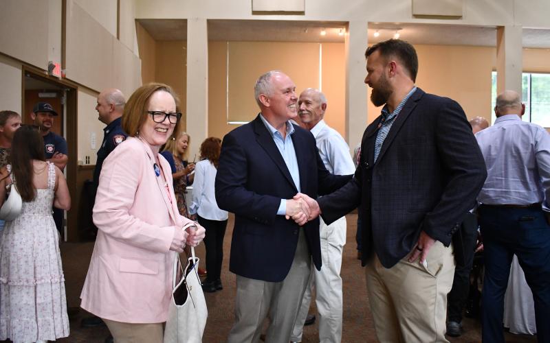Megan Horn/The Clayton Tribune. Sky Valley Mayor Benita Cotton-Orr, left, Forward Rabun/Rabun County Chamber of Commerce President Rick Story and Sen. Bo Hatchett, Georgia State Senate for District 50 converse at the fourth annual First Responders’ Appreciation Dinner held Aug. 27.