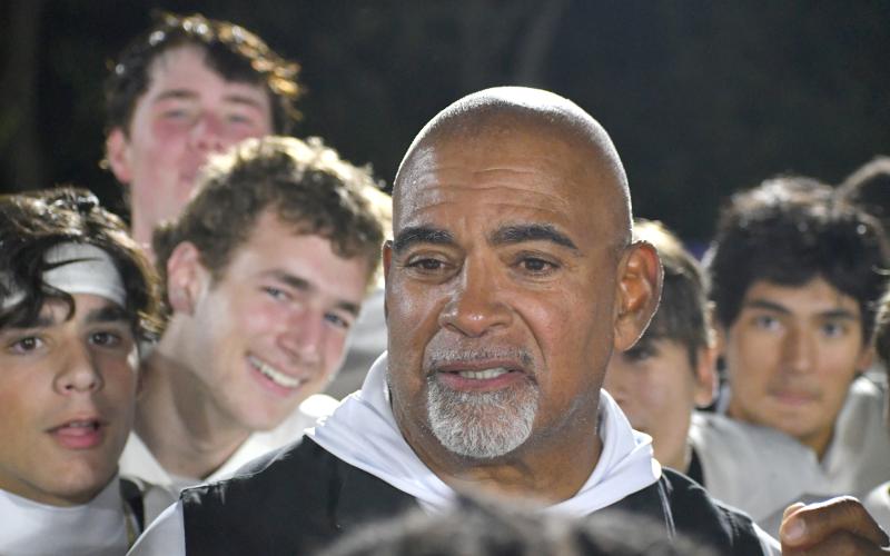 Wesley Branch/The Clayton Tribune. The Rabun Gap football team celebrates after defensive line coach Joe Crosby rallies the “monsters” after the Eagles’ 28-27 overtime win versus Christian Brothers College on Oct. 2.