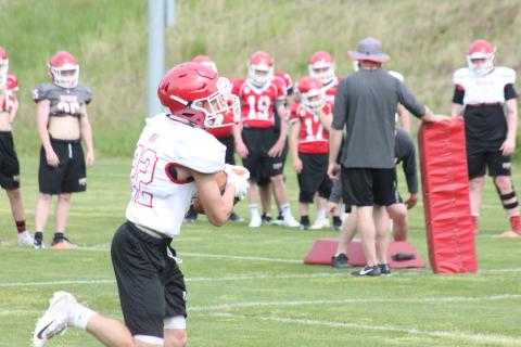 Rabun County cornerback Hunter Moore (22) catches a pass during a drill at a practice in Tiger in May. (Photo By Glendon Poe/The Clayton Tribune)