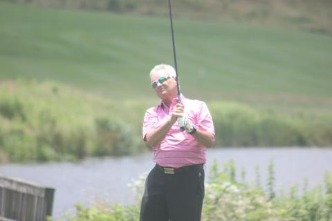 Jay Anderson watches his shot during the Sid Weber Memorial Cancer Fund golf tournament at Sky Valley Country Club last Wednesday. (Photo by Glendon Poe/The Clayton Tribune)