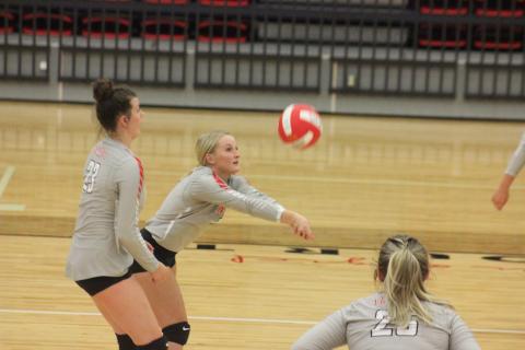 Rabun County’s Ali Ramey, right, digs at the ball, while teammate Destiny Deetz awaits the bounce during a match against Lumpkin County at Ken Byrd Court in Tiger on Tuesday night. (Glendon Poe/The Clayton Tribune)