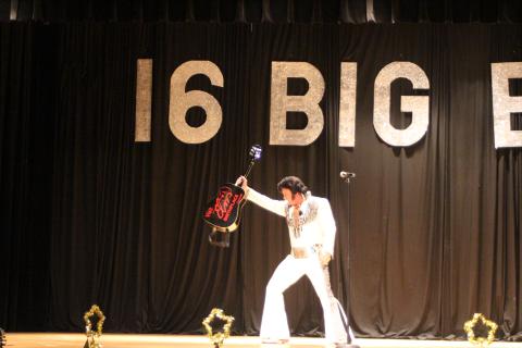 Megan Broome/The Clayton Tribune. World Champion Elvis Tribute Artist David Lee entertains a crowd of Elvis fans who attended a concert on the weekend of the 2019 Big E Festival and Elvis Tribute Artists Competition by singing, dancing and showing off his guitar. 