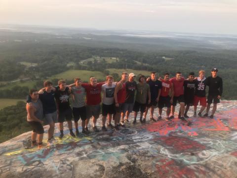 Rabun County senior football players are pictured with coach Jaybo Shaw at Currahee Mountain. (Submitted Photo)
