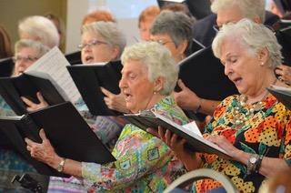 Wayne Knuckles/The Clayton Tribune. Kathleen Arbitter and Linda Brandsma join the rest of the choir in song as Clayton Baptist Church celebrated their 200th anniversary Sunday. 