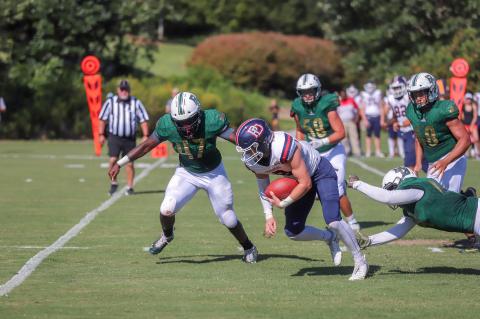 Rabun Gap-Nacoochee linebacker Kyle Ormsby (47), and teammates Gavin Anderson (58) and Deston Worthy (8) pursue a Providence Day (N.C.) ballcarrier during a game in Rabun Gap on Aug. 30. (Rabun Gap-Nacoochee School)