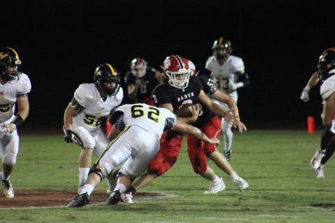 North Murray defensive lineman Hayden Jones (62) attempts to tackle Rabun County linebacker AJ Wheeler (3) after an interception during the second half at Frank Snyder Memorial Stadium in Tiger on Aug. 30. (Glendon Poe/The Clayton Tribune)