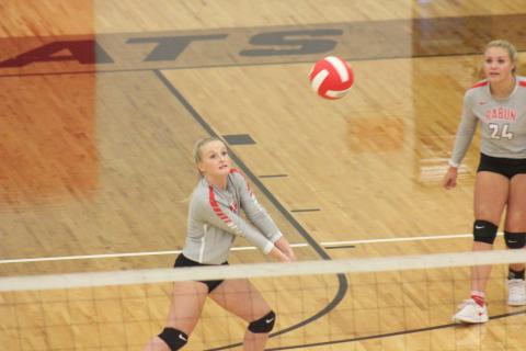 Rabun County’s Ali Ramey, left, digs at a ball, while teammate Beth Payne looks on during a match against Cherokee Bluff at Rabun County’s Ken Byrd Court in Tiger last Thursday. (Glendon Poe/The Clayton Tribune)