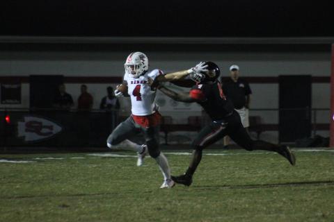 Rabun County wide receiver Braxton Hicks, left, stiff-arms Stephens County tight end Kenny Davis during the first half in Toccoa last Friday night. (Glendon Poe/The Clayton Tribune)
