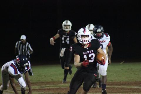 Rabun County running back Brody Jarrard (13) carries the ball behind blockers during the first half against Putnam County at Frank Snyder Memorial Stadium in Tiger last Friday night. (Glendon Poe/The Clayton Tribune)