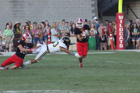 Rabun County wide receiver Sam Adams, left, blocks a North Murray defender, while teammate Sutton Jones, right, runs for additional yards during the first half at Frank Snyder Memorial Stadium in Tiger last Friday night. (Glendon Poe/The Clayton Tribune)