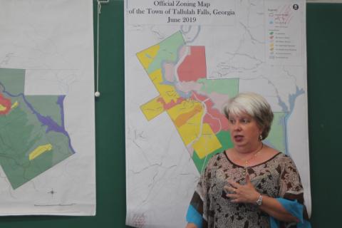 Tallulah Falls Mayor Teri Dobbs looks over a zoning map of the town at a joint work session of the City Council, Downtown Development Authority and Planning Commission last Thursday. City officials plan to add updates to the 1999 zoning map. 
