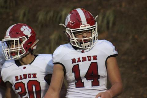 Rabun County wide receiver Sutton Jones (20) and quarterback Gunner Stockton walk back to the sideline after Stockton ran for a  touchdown during the second half against Monticello in Monticello last Friday night. (Glendon Poe/The Clayton Tribune)
