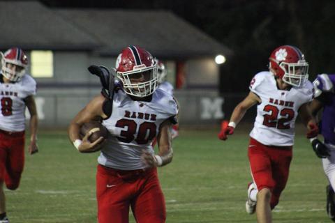Rabun County linebacker Hoff Windham (30) runs behind blockers after intercepting a Monticello pass during the first half in Monticello last Friday night. (Glendon Poe/The Clayton Tribune)