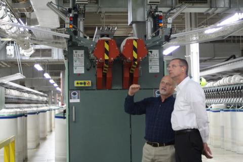 Weldon Wahl, plant manager for the Parkdale Rabun Gap facility, takes Rep. Doug Collins, who represents Georgia’s 9th congressional district, on a tour of the Parkdale textile plant in Rabun County last Thursday. Wahl showed Collins the automated machinery inside the facility and introduced him to some of Parkdale’s employees. Parkdale is one of the largest providers of spun yarns in the world. 