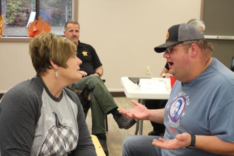 Lt. Misty Houston, Rabun County Emergency Medical Services, and Deputy Andy Beck help sort out people’s problems by walking through an example narrative of a peer in a crisis situation during a scenario-based workshop at Peer Support training held at Tabernacle Baptist Church last Monday. 