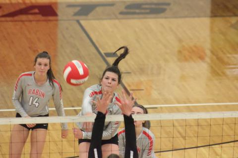 Rabun County’s Destiny Deetz, middle, attacks Union County, while teammates Gracie Deetz, left, and Emma Wofford watch during the GHSA Class A/AA Area 8-Public championship match at Ken Byrd Court in Tiger last Thursday night. (Glendon Poe/The Clayton Tribune)
