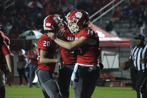 Rabun County wide receiver Sutton Jones (20) is congratulated by quarterback Gunner Stockton (14) and other teammates after making a touchdown catch during the first half against Social Circle at Frank Snyder Memorial Stadium in Tiger last Friday night. (Glendon Poe/The Clayton Tribune)