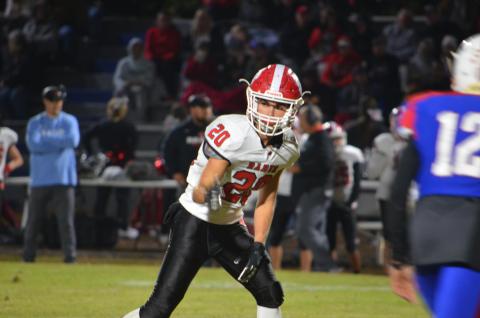 Wayne Knuckles/The Clayton Tribune. Junior wide receiver Sutton Jones (20) checks his spot with the referee against Oglethorpe last Friday night.