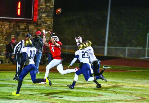 Scott Poss/The Clayton Tribune. Braxton Hicks goes up for a Gunner Stockton pass against B.E.S.T. Academy Friday night. 