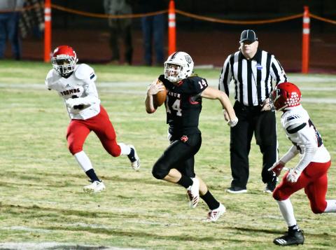 Scott Poss/The Clayton Tribune. Gunner Stockton scrambles against Toombs County Friday night. 