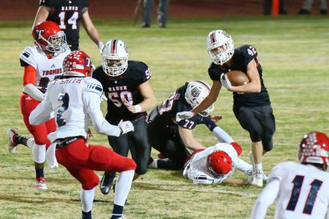 Scott Poss/The Clayton Tribune. Clayton Dixon leads the blocking as Cory Keller picks up yardage against Toombs County Friday night. 