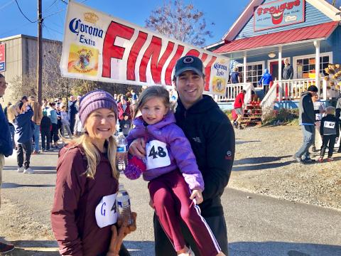 Daniela Cintron/ Allegra Perry, 5, enjoyed an early 5K run with her parents, Austin and Holly, finishing strong in first place in her age category
