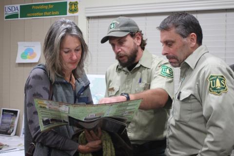Megan Broome/The Clayton Tribune. Terri Jagger Blincoe, left, discusses the United States Forest Service Foothills Landscape Project with Phillip Waldrop, United States Forest Service, and Derek Fusco, Chattahoochee-Oconee National Forests.