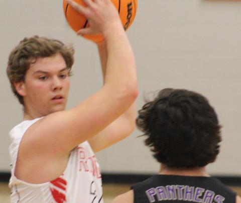 (Andy Diffenderfer/The Clayton Tribune) Clayton Dixon looks for an open teammate last Friday while defended by Union County’s Austin Cumbess. 