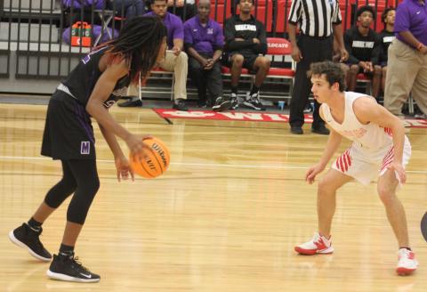  Andy Diffenderfer/The Clayton Tribune. Sam Adams defends Monticello’s M.J. Stone in the Wildcats’ Region 8-AA home victory last Saturday. 