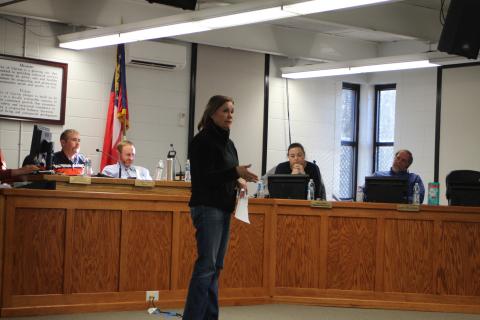 Megan Broome/The Clayton Tribune. Kathy Lee addresses Clayton City Council members at their meeting Tuesday to discuss meter cost concerns on a property she owns in Mountain City where she plans to have a community of tiny homes. 