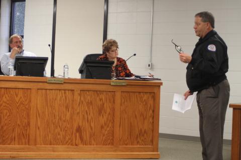 Megan Broome/The Clayton Tribune. Brendan Thompson, right, general manager for the Rabun County Water and Sewer Authority, discusses a partially unpaid August 2019 water bill for the city of Clayton with Council Members at their meeting on Tuesday.