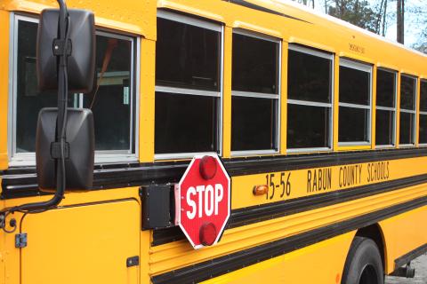 Megan Broome/The Clayton Tribune. Georgia law requires motorists traveling in both directions of a roadway to stop completely if a grass median or physical barrier is not present. 
