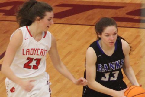 Andy Diffenderfer/The Clayton Tribune Rabun County's Gracie Deetz shadows Hailey Seahorn of Banks County in a Region 8-AA semifinal. 