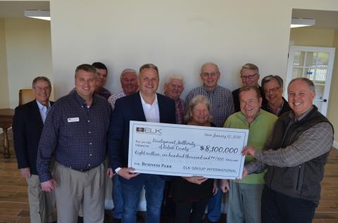 Wayne Knuckles/The Clayton Tribune Development Authority of Rabun County board members marked the completion of the sale of the former Fruit of the Loom building to ELK International for $8.1 million Monday. From left are: Janney Sanders (DARC attorney), Claude Dillard (DARC chairman0, John Dillard, Greg Brown, Todd Webb, ELK Group International COO, Jim Bleckley, Leckie Stack, Elliott Keller, Bob Fink, Pete Halter, Robert Pittman and Rick Story, Director of Development for Rabun County.