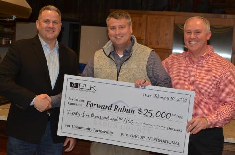 Wayne Knuckles/The Clayton Tribune Todd Webb, left, COO of Elk International, presents a check for $25,000 to Development Authority of Rabun County Board Chairman Claude Dillard (center) and Forward Rabun Director Rick Story at a recent meeting.