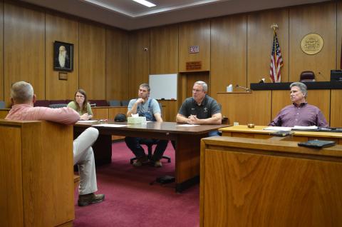 Wayne Knuckles/The Clayton Tribune. From left, County Clerk Linda Ramey and commissioners Will Nichols, Kent Woerner and Greg James at last Thursday's emergency meeting of the Rabun County commission. 