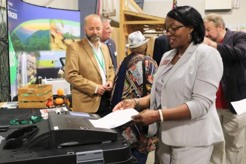 Rep. Patty Bentley tests out a new voting machine during a demonstration at the Georgia State Fair. (Secretary of State’s office)